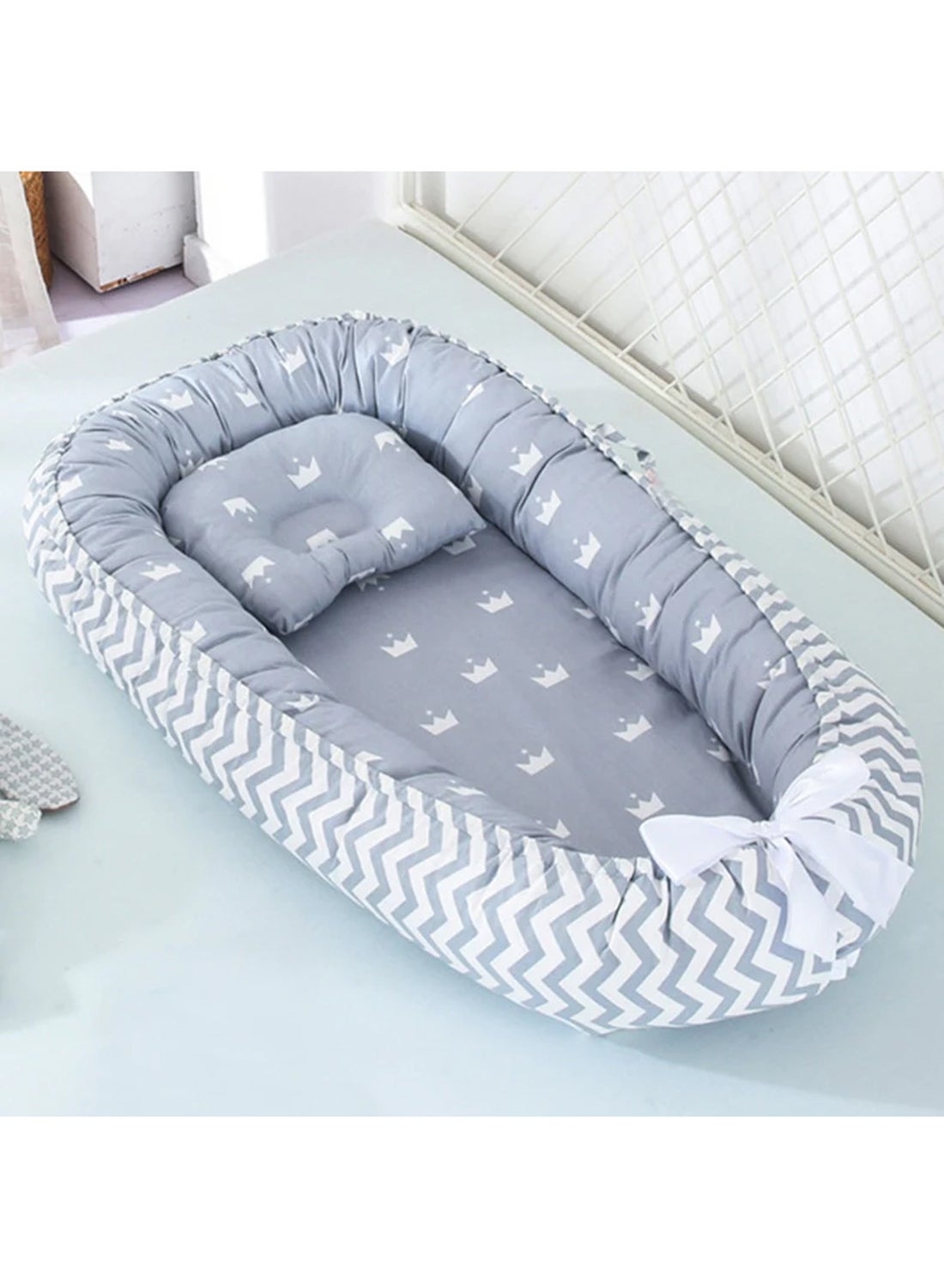 The cozy portable baby nest bed offers a comfy spot that lets the baby rest, lounge, play, cuddle, - Image 4