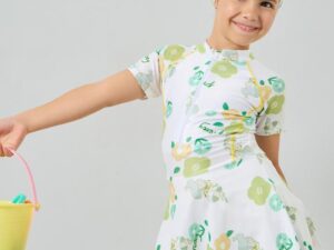 Adorable white floral swim dress with cap, crafted from stretchy polyester knit for comfort and