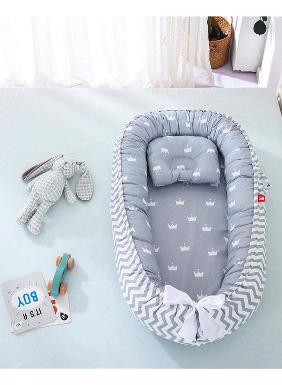 The cozy portable baby nest bed offers a comfy spot that lets the baby rest, lounge, play, cuddle, - Image 3
