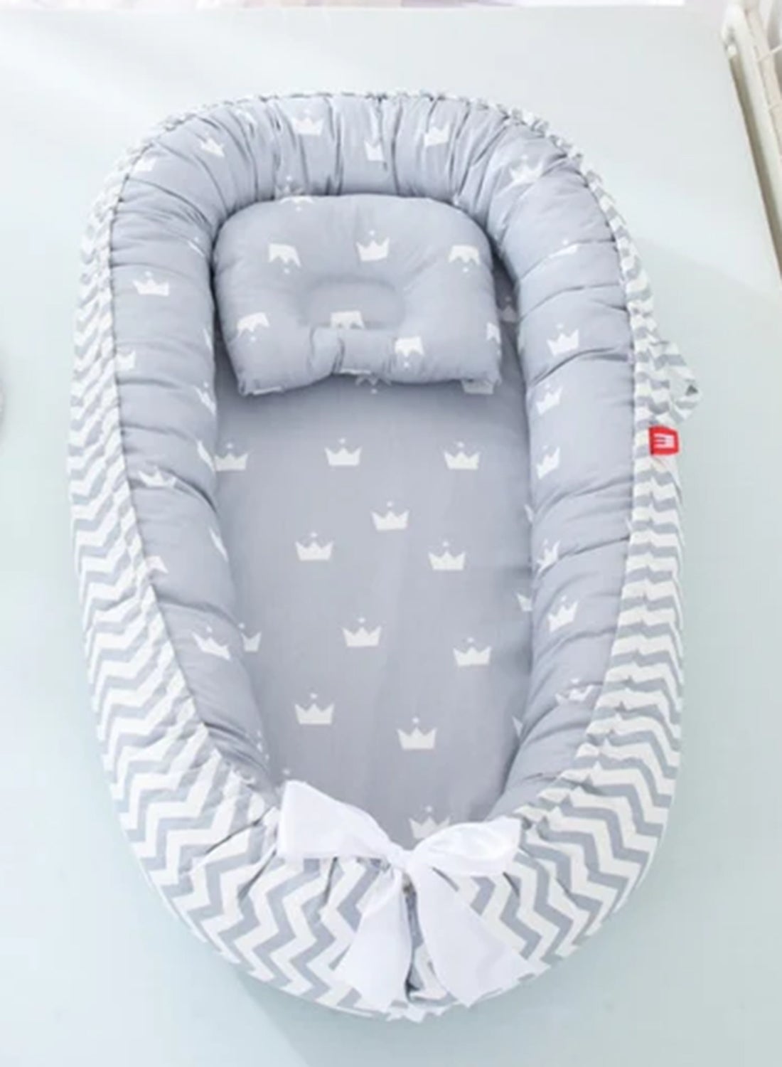 The cozy portable baby nest bed offers a comfy spot that lets the baby rest, lounge, play, cuddle, - Image 5