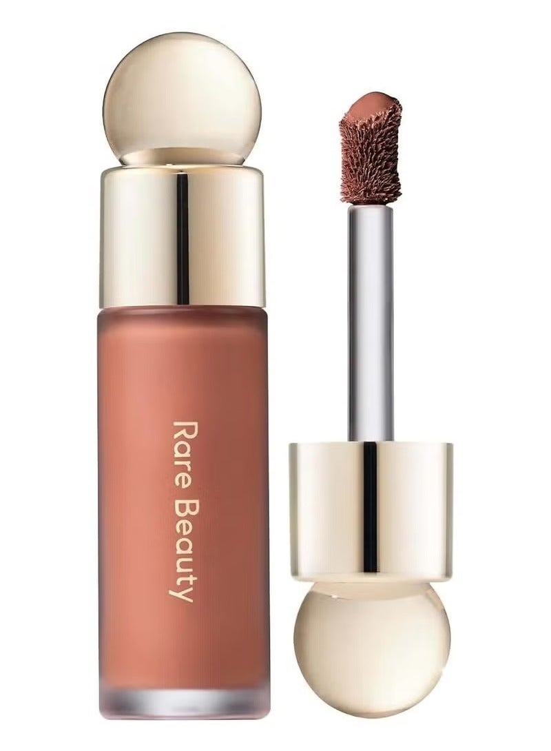 Experience a natural, radiant flush with Rare Beauty Soft Pinch Liquid Blush in Virtue — a soft